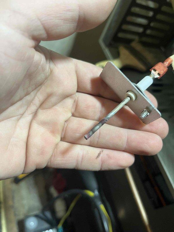 Responded to service call for non-heating furnace. Diagnosed E03 error code on Emerson control board indicating flame sensor malfunction. Removed, cleaned, and reinstalled flame sensor to restore proper flame detection. Unit now operating normally with consistent heat production.