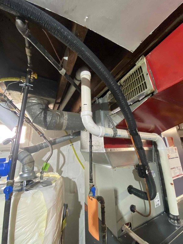 Conducted evaluation of existing HVAC system following client referral from Jeff. Inspection revealed aging unit in mechanical room with PVC drain system and insulated ductwork. Assessed floor register condition and airflow delivery throughout home for potential full system replacement.