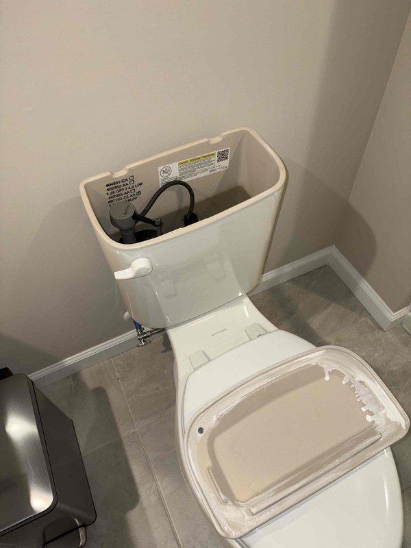 Responded to service call to replace basement macerator/grinder pump. Inspected toilet components during assessment, noting functional fill valve and tank mechanism with proper water level. Completed replacement of waste pump system to restore proper basement drainage functionality.