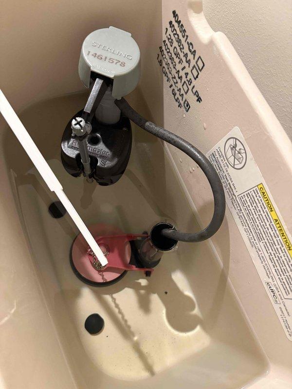 Responded to service call to replace basement macerator/grinder pump. Inspected toilet components during assessment, noting functional fill valve and tank mechanism with proper water level. Completed replacement of waste pump system to restore proper basement drainage functionality.