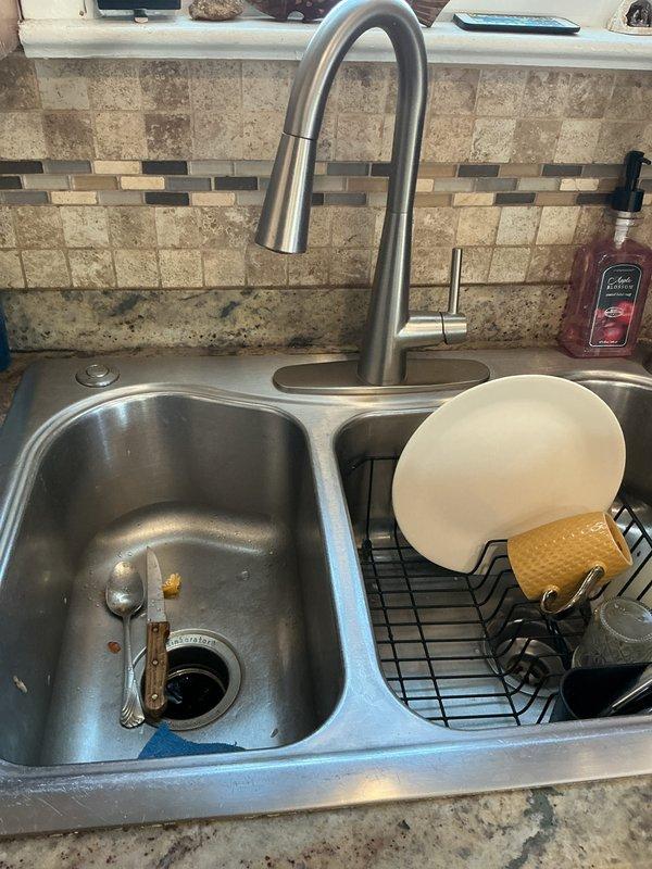 Conducted regular plumbing membership maintenance visit to address slow bathroom drains. Inspected kitchen sink drainage system and basement dryer vent ductwork. Performed standard drain maintenance procedures and verified proper venting configuration of flexible metallic ductwork in utility area.