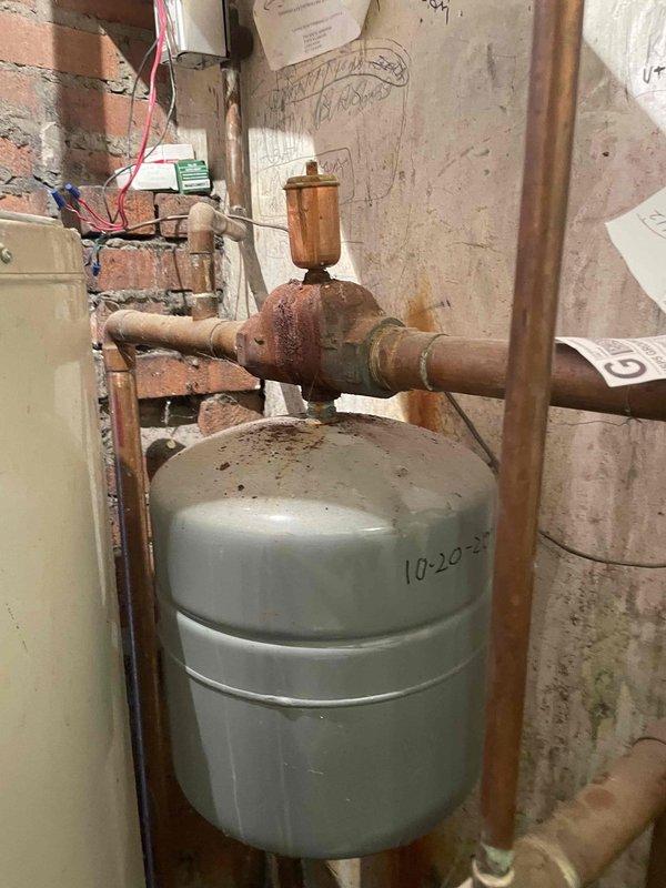 Responded to customer complaint regarding uneven heating where oil boiler was only heating one side of the house. Diagnosed issue with zone valve connection, which was preventing proper distribution of heated water throughout the system. Observed significant corrosion on valve assembly at expansion tank and deteriorating pipe insulation. Reconnected and tested zone valves to restore balanced heating to all areas of the home.