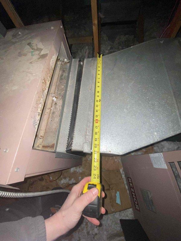 Conducted inspection of existing HVAC system in nursing home attic. Found significant deterioration of current equipment with rotting components. Measured ductwork connections (24") and examined Reznor unit with associated metal ductwork and connections. Recommended replacement with mini split system due to condition of existing equipment and space constraints.