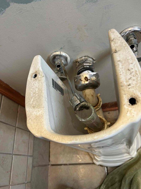 Responded to service call for water softener maintenance. Upon inspection, found salt tank completely empty ("bone dry") and evidence of mineral buildup. Refilled salt tank, performed system check, and verified proper operation of the water treatment system including associated plumbing fixtures.