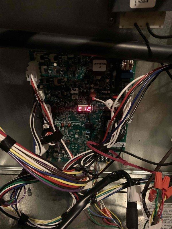 Responded to service call for non-functioning furnace and digital thermostat. Diagnostics revealed error code E12 on the control board, indicating system fault. Performed combustion analysis showing CO levels at 50 PPM and oxygen at 8.6%, confirming improper combustion. Repaired wiring connections to control board and reset system, restoring normal heating operation and thermostat functionality.