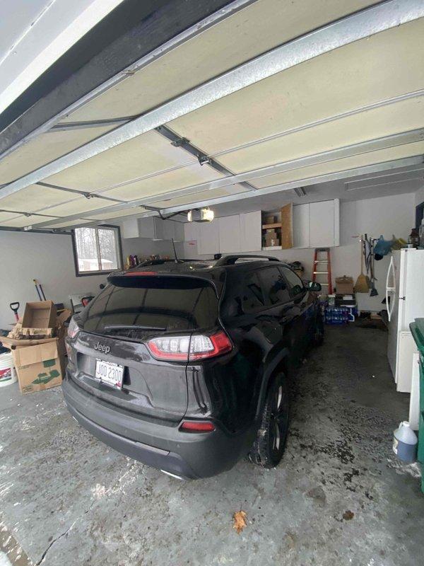 Performed follow-up assessment for previously sold tankless water heater installation. Conducted comprehensive evaluation of garage space for potential Reznor garage heater installation. Inspected electrical panel to verify capacity and compatibility for proposed heating system. Documentation includes photos of garage layout and electrical infrastructure to support proper equipment sizing and installation requirements.