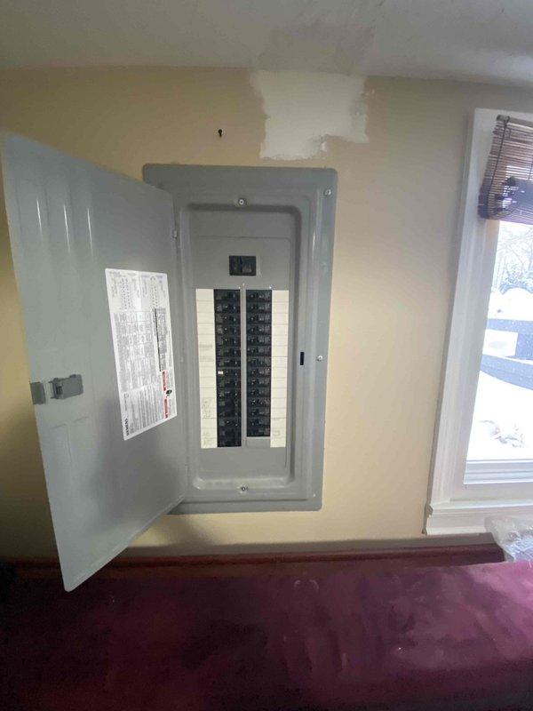 Performed follow-up assessment for previously sold tankless water heater installation. Conducted comprehensive evaluation of garage space for potential Reznor garage heater installation. Inspected electrical panel to verify capacity and compatibility for proposed heating system. Documentation includes photos of garage layout and electrical infrastructure to support proper equipment sizing and installation requirements.