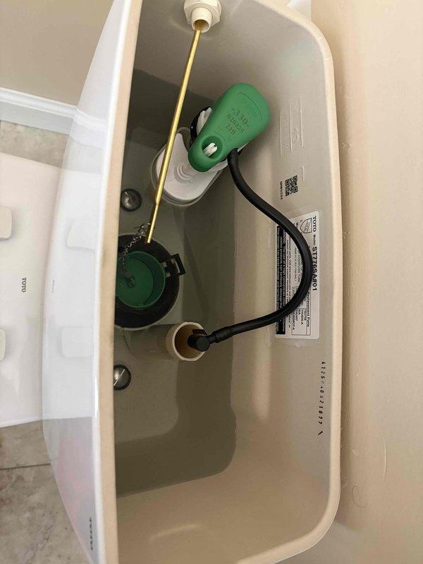 Returned to complete previously sold bathroom work after customer's new flooring installation. Installed toilet with new wax ring and set vanity using construction adhesive. Connected supply lines with new angle stops and completed p-trap installation for lavatory. All fixtures properly sealed with silicone where required and tested for proper operation.