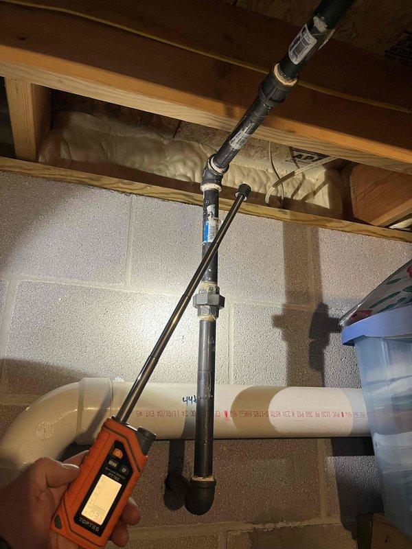 Conducted pressure test on gas system to locate leak that was previously undetected. Utilized pressure testing equipment to systematically check connections throughout the basement utility area. Identified leak at brass valve assembly connected to black pipe under wooden joists. Repaired compromised connection and verified system integrity with final pressure test, confirming resolution of the gas leak issue.