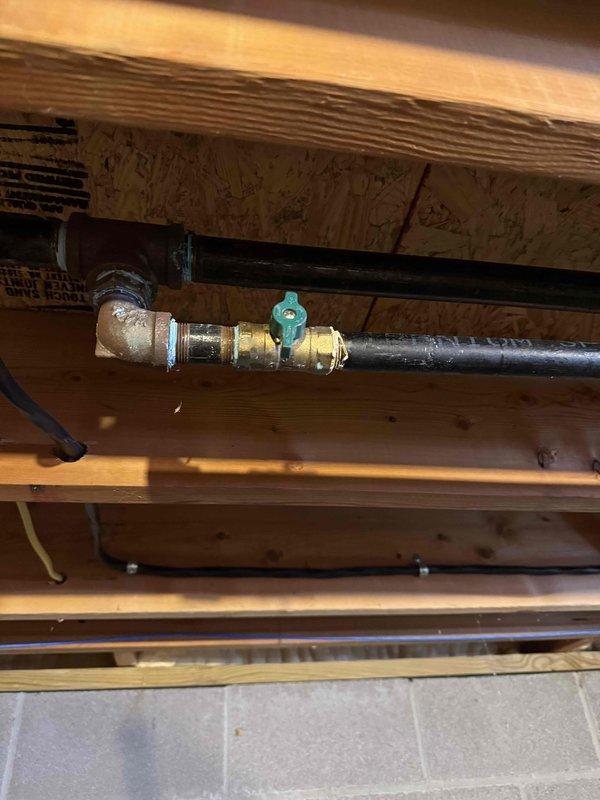Conducted pressure test on gas system to locate leak that was previously undetected. Utilized pressure testing equipment to systematically check connections throughout the basement utility area. Identified leak at brass valve assembly connected to black pipe under wooden joists. Repaired compromised connection and verified system integrity with final pressure test, confirming resolution of the gas leak issue.