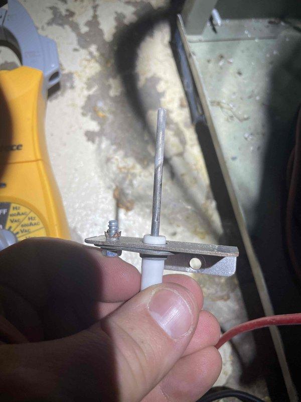 Diagnosed high-pitch whine in furnace system; removed and inspected flame sensor which showed signs of corrosion. Cleaned sensor assembly with emery cloth, reinstalled component, and tested system operation. Furnace now functioning without abnormal noise.