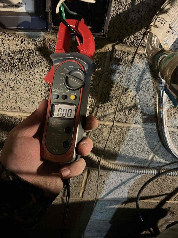 Diagnosed no-water issue on customer's well system. Performed electrical testing with clamp meter to verify pump circuit functionality. Located and repaired faulty wiring connections at the well control box despite challenging winter conditions.