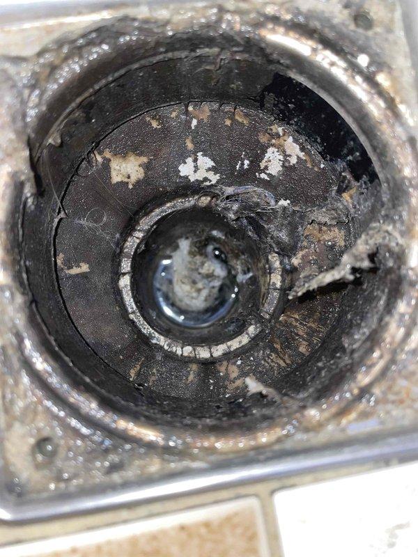 Completed membership plumbing maintenance visit to address reported gurgling sound from sink when toilets flush. Inspected drain system and found significant buildup of residue and debris causing restricted flow. Also identified minor leak at copper pipe connection to water heater with visible moisture on appliance panel. Cleared drain blockage and tightened/repaired water heater fitting connection to resolve both issues.