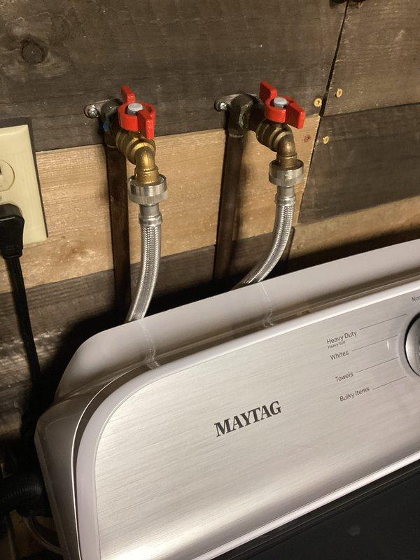 Conducted routine plumbing membership maintenance visit, inspecting laundry room water supply lines and washing machine connections for proper function and potential leaks. Examined bathroom plumbing fixtures including sink faucet, drain, and water supply lines, confirming all components were in good working condition with no signs of leakage or wear.