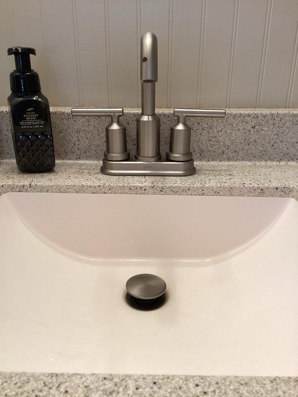Conducted routine plumbing membership maintenance visit, inspecting laundry room water supply lines and washing machine connections for proper function and potential leaks. Examined bathroom plumbing fixtures including sink faucet, drain, and water supply lines, confirming all components were in good working condition with no signs of leakage or wear.