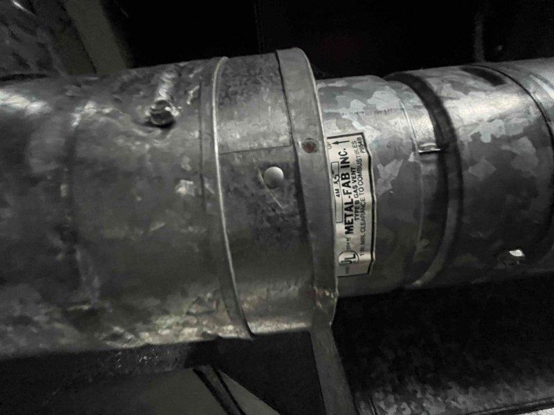 Conducted assessment of failed furnace for replacement. Current system features galvanized metal ductwork with Metal-Fab, Inc. components. Customer requested options comparable to previously quoted 80% 2-stage Bryant system with chimney relining and existing thermostat. Inspection revealed furnace located in basement utility area with accessible ductwork running along ceiling joists.