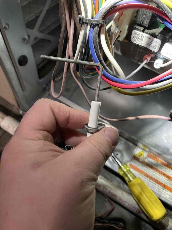 Diagnosed intermittent furnace shutdown issue and discovered faulty ignitor causing system failure. Replaced ignition electrode after inspection revealed damage to the ceramic insulator and electrode tip. Tested system through multiple cycles to confirm proper operation and restored reliable heat function.