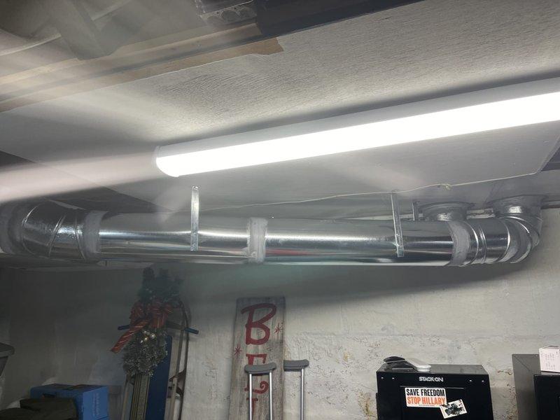 Completed follow-up furnace installation initially sold by Jon and flipped by Jeffdz. Installed galvanized metal ductwork system in basement/utility area and performed combustion analysis using Testo 310, confirming proper CO levels at 5 ppm and 1.5% combustion efficiency. All systems functioning within specifications.