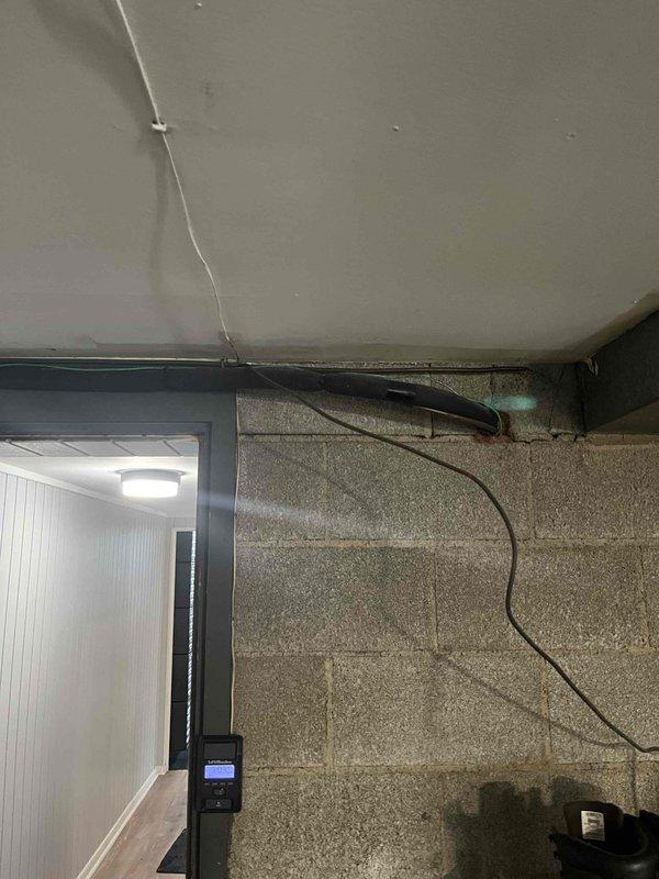 Conducted initial assessment of potential HVAC replacement project following lead referral. Inspected utility access area with concrete slab and documented existing wall junction conditions where current system interfaces with the structure. Evaluated equipment placement options and identified necessary modifications for proper installation of new system.