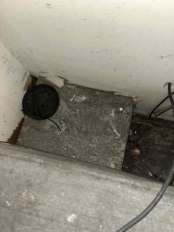 Conducted initial assessment of potential HVAC replacement project following lead referral. Inspected utility access area with concrete slab and documented existing wall junction conditions where current system interfaces with the structure. Evaluated equipment placement options and identified necessary modifications for proper installation of new system.