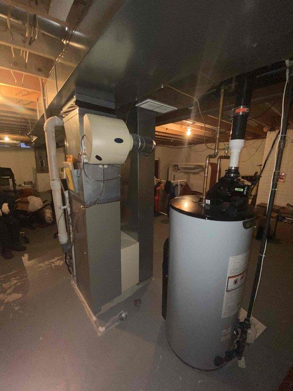 Performed diagnostic assessment on 2004 model furnace in client's basement which was confirmed non-operational. Inspection revealed end-of-life equipment with standard vertical configuration, connected to existing ductwork and PVC venting system. Client was presented with replacement options and documentation for consideration.