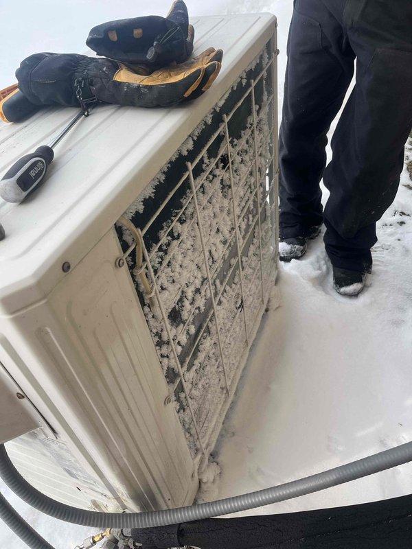 Responded to service call for heat pump not producing heat. Inspection revealed significant ice and frost accumulation on outdoor condensing unit, indicating restricted airflow and improper defrost cycle operation. Performed defrost cycle testing and cleared ice buildup to restore proper system function.