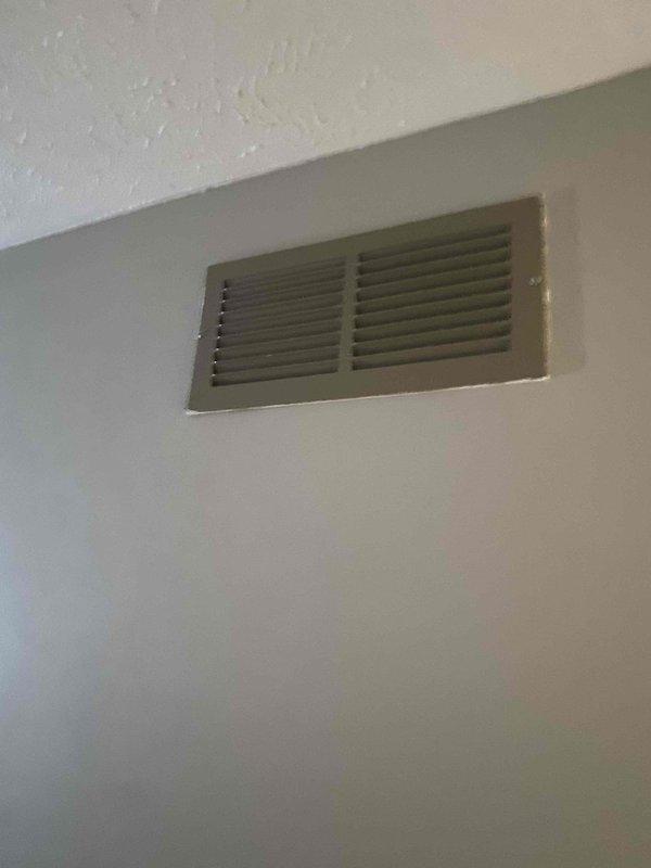 Performed comprehensive assessment of non-functional gas furnace system. Observed severely aged unit that customer reported failed several days prior. Exterior inspection revealed outdoor condensing unit completely snow-covered with potential maintenance issues. Interior inspection showed standard return air grille in functional condition. Based on system age and condition, replacement recommended over repairs.