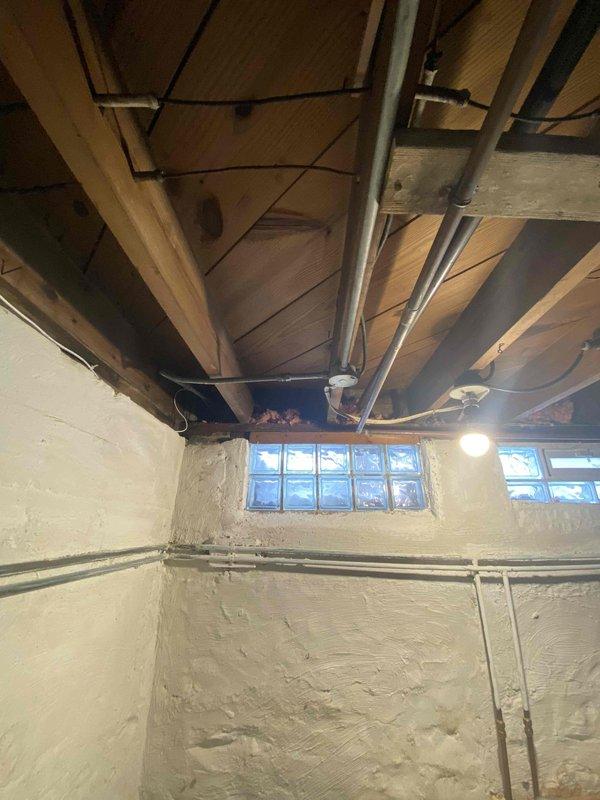 Conducted follow-up service call regarding persistent water leak at the base of recently glued pipe in the basement mechanical area. Inspected air handler installation and surrounding plumbing connections. Identified leak source at the connection point and resealed joint to prevent further moisture issues.
