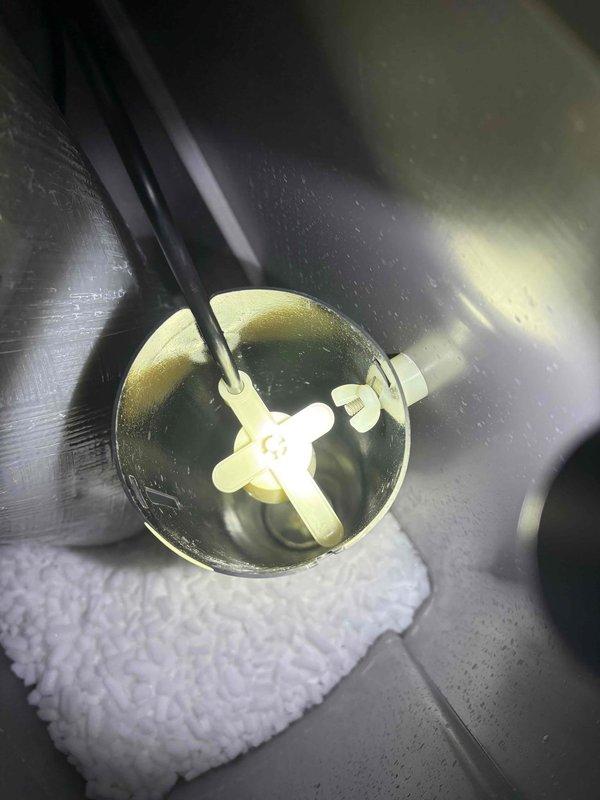 Diagnosed customer-installed 6-month-old Rheem water softener that was failing to automatically recharge. Identified faulty brine valve assembly with visible mineral buildup and corrosion at copper pipe connections. Repaired plumbing connection leak and restored proper water flow to enable automatic recharge cycle functionality.