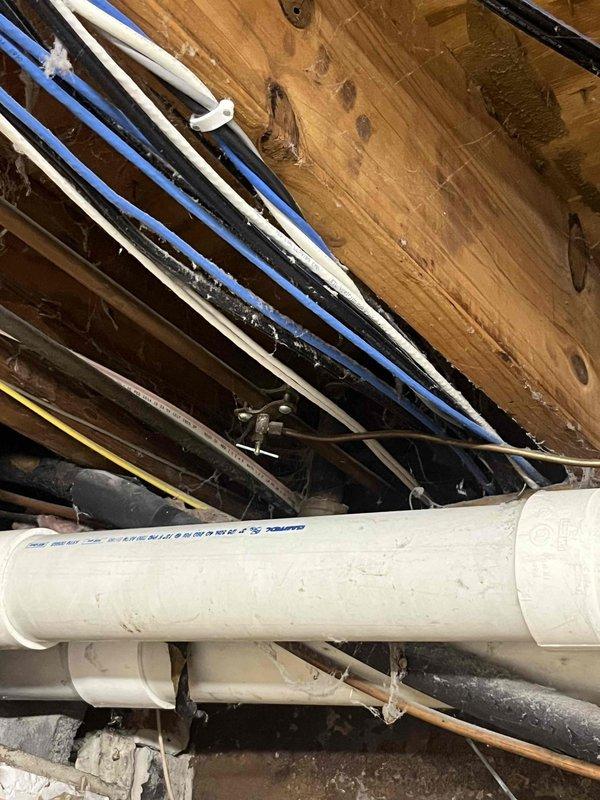 Performed diagnostic assessment on failed April air humidifier. Inspected plumbing connections and drainage system in utility area. Documented existing installation configuration for replacement quote. Customer informed about replacement options and maintenance plan possibilities.