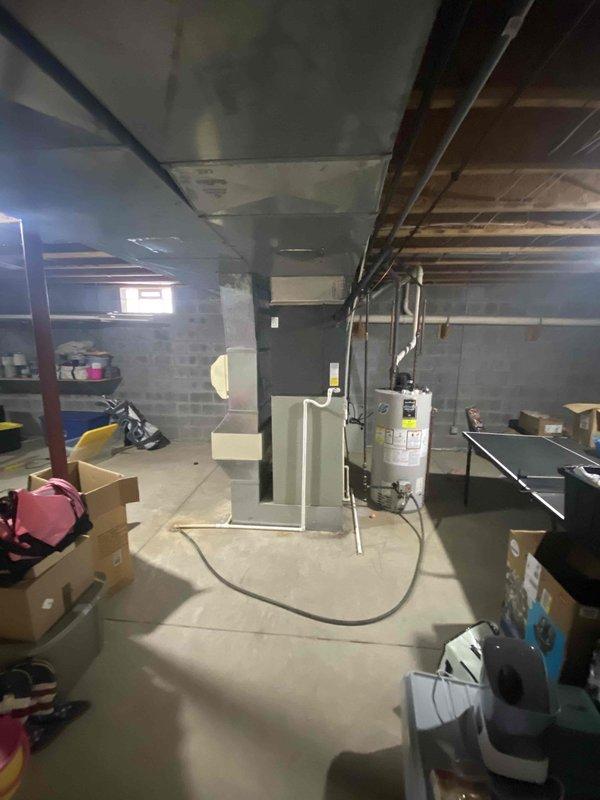 Conducted comprehensive assessment of 28-year-old furnace system in unfinished basement after customer reported temperature control issues, burning odors, and suspected fan motor failure. Visual inspection revealed significant age-related deterioration of the HVAC system, including compromised ductwork and potential safety hazards. Recommended complete system replacement due to unit's advanced age, declining performance, and safety concerns.