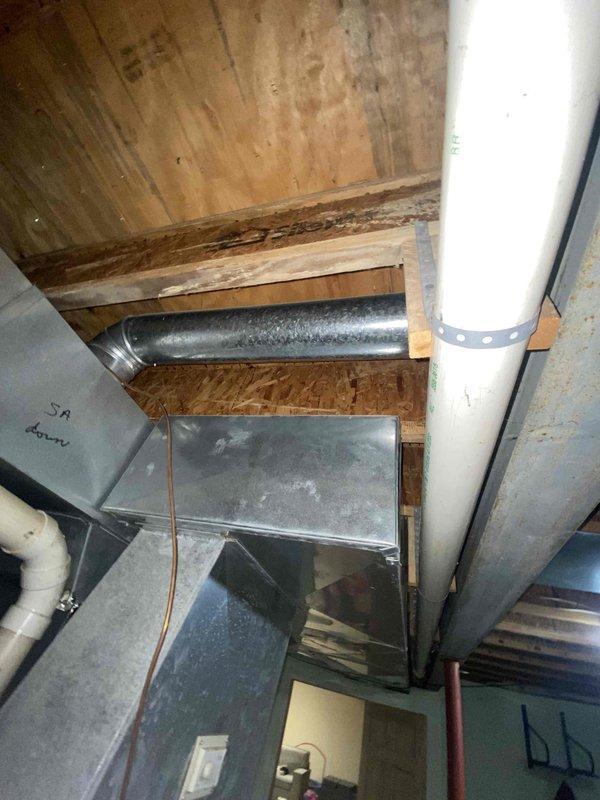 Conducted comprehensive assessment of 28-year-old furnace system in unfinished basement after customer reported temperature control issues, burning odors, and suspected fan motor failure. Visual inspection revealed significant age-related deterioration of the HVAC system, including compromised ductwork and potential safety hazards. Recommended complete system replacement due to unit's advanced age, declining performance, and safety concerns.