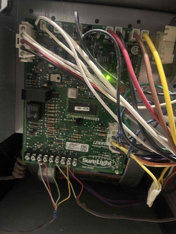 Diagnosed intermittent operation issue on guest house gas furnace. Inspected flame sensor and control board (White-Rodgers/Lennox SureLight module), confirmed proper function of LED indicator. Cleaned flame sensor to restore reliable ignition sequence and normal operation.