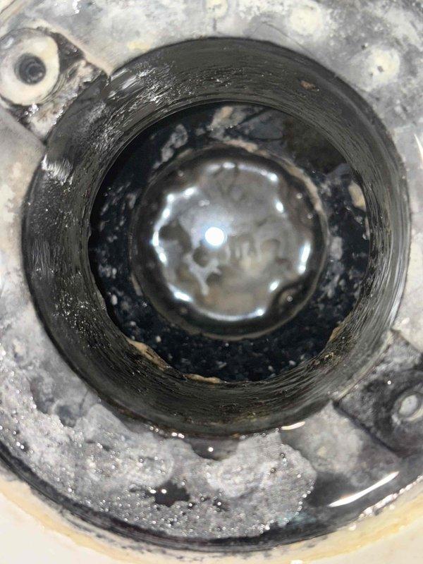 Responded to service call for clogged tub and shower drains. Investigated potential frozen line concern. Removed and cleared substantial mineral buildup and debris from drain assembly, collecting residual material for proper disposal. Both drains now functioning properly with improved water flow.