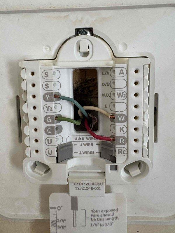 Conducted diagnostic assessment on HVAC system for Debbie Knuff regarding non-functioning blower motor. Inspected thermostat wiring connections (green, white, and red wires properly connected to terminals) and evaluated Aprilaire humidifier control unit (set between positions 5-6). Determined blower motor requires replacement.