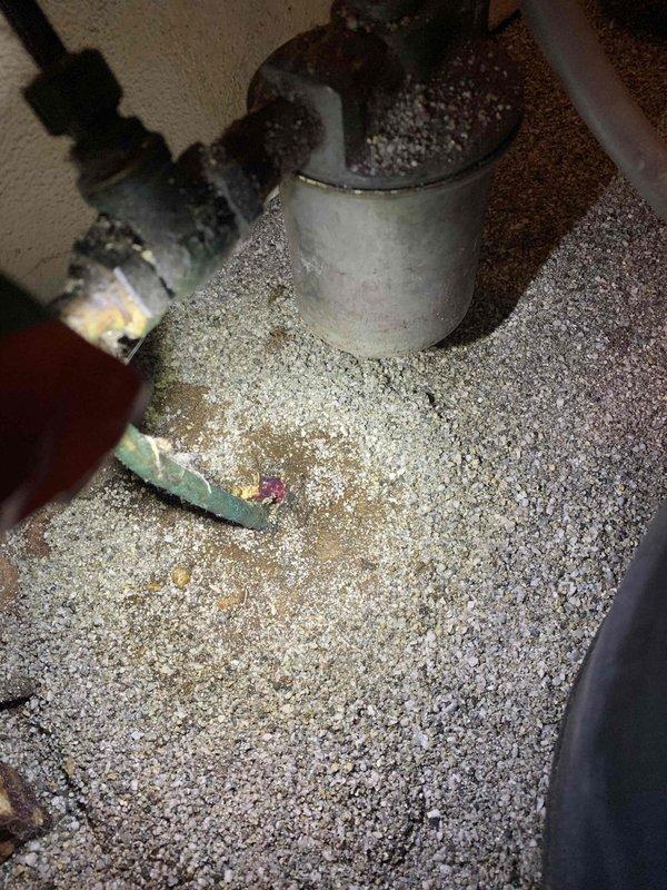 Responded to service call for malfunctioning boiler system with active oil leak. Inspection revealed oxidized piping connections surrounded by contaminated insulation material. Examined water treatment system and associated pump assembly, identifying issues with the control unit and connected plumbing components. Repaired oil leak, replaced damaged fittings, and restored proper system operation.