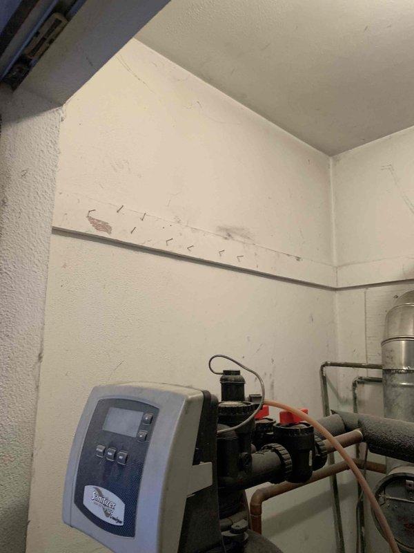 Responded to service call for malfunctioning boiler system with active oil leak. Inspection revealed oxidized piping connections surrounded by contaminated insulation material. Examined water treatment system and associated pump assembly, identifying issues with the control unit and connected plumbing components. Repaired oil leak, replaced damaged fittings, and restored proper system operation.