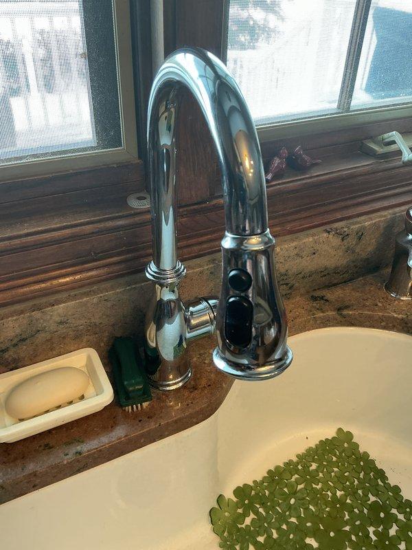 Responded to plumbing club member's issue with kitchen faucet exhibiting decreasing water pressure as temperature increases. Inspected under-sink plumbing components and supply lines, noting temporary resolution occurs when cycling shut-off valve. Diagnosed potential mineral buildup or pressure regulator issue in faucet assembly that will require follow-up service for permanent resolution.