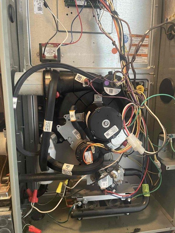 Completed heating maintenance service with installation of new inducer motor. Relocated fresh air intake to improve system performance. Used digital level tool to ensure proper installation alignment. Accessed and worked within furnace cabinet, managing complex wiring and component connections.