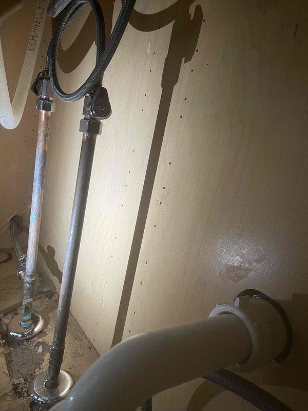 Responded to a water leak issue in upstairs bathroom affecting ceiling below. Diagnosed toilet leak and drainage problems causing water to back up in sink and toilet. Replaced damaged supply lines and drain pipes under fixtures, and installed new P-trap assembly to resolve gurgling and backflow issues. Advised customer to avoid using affected bathroom until repairs fully cure.