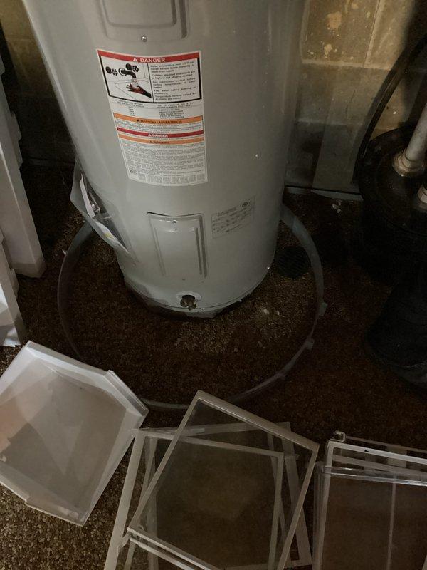 Performed inspection of existing water treatment system which was found to be on bypass. Noted that the equipment installed was not our brand. Documented current water heater installation including expansion tank and associated plumbing connections. Water heater appears to be properly installed with all necessary supply lines, pressure relief valves, and connections in place.
