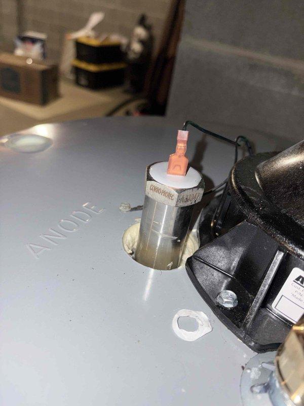 Responded to service call for a leaking 75-gallon propane power-vented water heater. Observed active leakage from the bottom of the tank and visible rust rings on concrete floor indicating ongoing issue. Replaced unit with new propane-compatible model, installing customer-requested 3/4 inch brass ProPress quarter turn ball valves as specified by homeowner (pipefitter by trade).