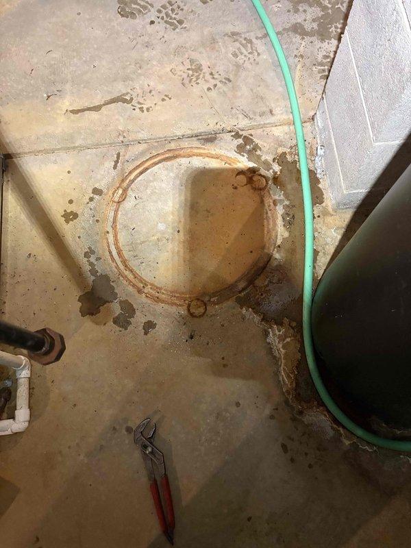 Responded to service call for a leaking 75-gallon propane power-vented water heater. Observed active leakage from the bottom of the tank and visible rust rings on concrete floor indicating ongoing issue. Replaced unit with new propane-compatible model, installing customer-requested 3/4 inch brass ProPress quarter turn ball valves as specified by homeowner (pipefitter by trade).