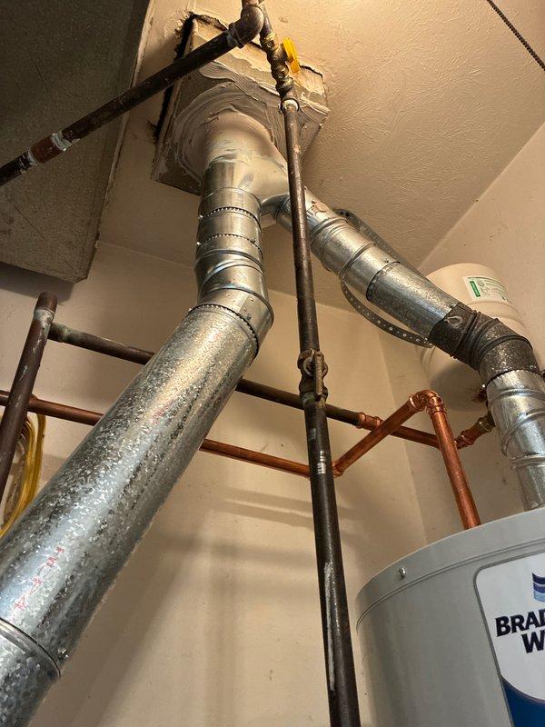 Conducted inspection of exhaust system to prepare quote. Identified significant corrosion on copper piping and assessed condition of galvanized metal ductwork connections in ceiling/wall penetrations. Documented existing ventilation infrastructure including support structures and potential moisture issues for comprehensive exhaust work proposal.