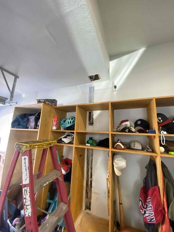 Technicians Matt H. and Homer flipped the air handler after finding a frozen wall affecting the HVAC system. Diagnostic work was partially completed, with Matt scheduled to return for further assessment once the wall has fully thawed. Interior inspection revealed exposed furnace components requiring attention.