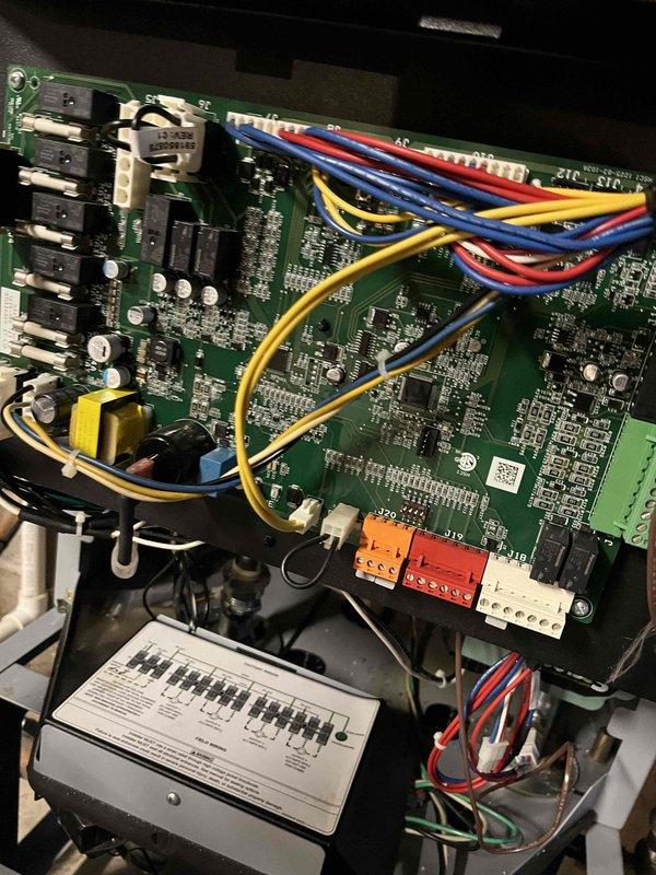 Completed warranty replacement of defective control board in HVAC system. Removed existing circuit board, installed new OEM replacement board, reconnected all control wiring harnesses, and verified proper system operation through testing. System now functioning as designed with no operational issues.