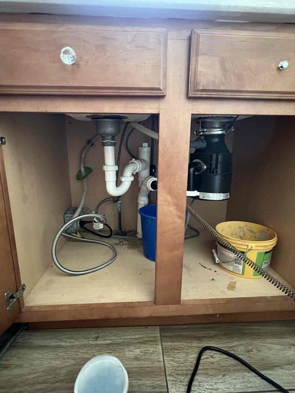 Successfully completed dishwasher reinstallation service sold by Sam F. Verified proper connections to existing plumbing system under sink cabinet, ensuring secure water supply lines and proper drainage. All connections were tested for leaks and proper function before completing the job.