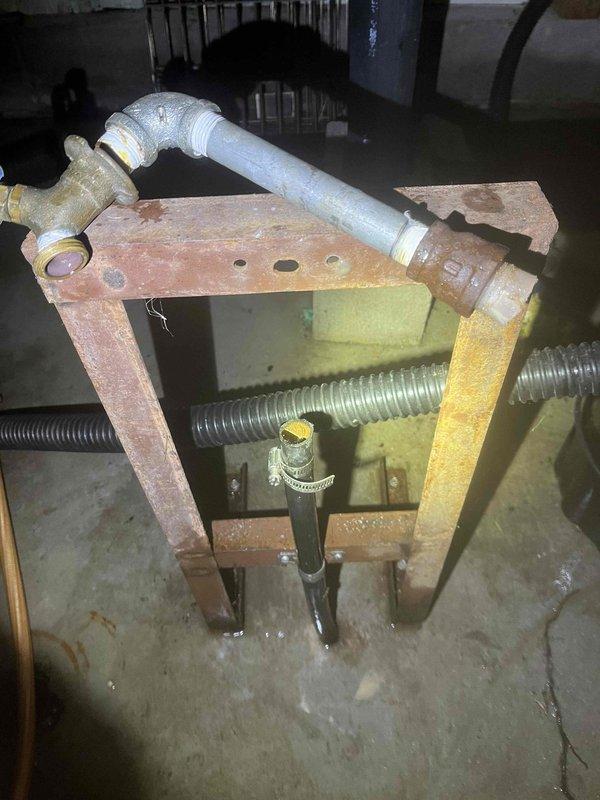 Responded to emergency call regarding a pipe burst. Upon arrival, confirmed customer had properly shut off main water line. Inspected the affected area in the garage, identifying significant rust and corrosion on metal framework supporting plumbing assembly. Repaired damaged section, replacing compromised PVC elbow joint and associated brass fittings. Tested system functionality after repair to ensure proper operation with no leaks.