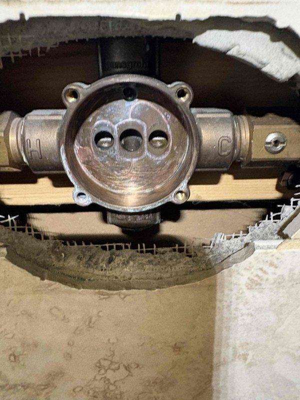Successfully completed rebuilding of Hansgrohe shower valve by removing damaged shower stem and installing replacement parts. Restored proper functionality to the shower control fixture, ensuring proper water flow and temperature regulation through the single-handle faucet assembly.