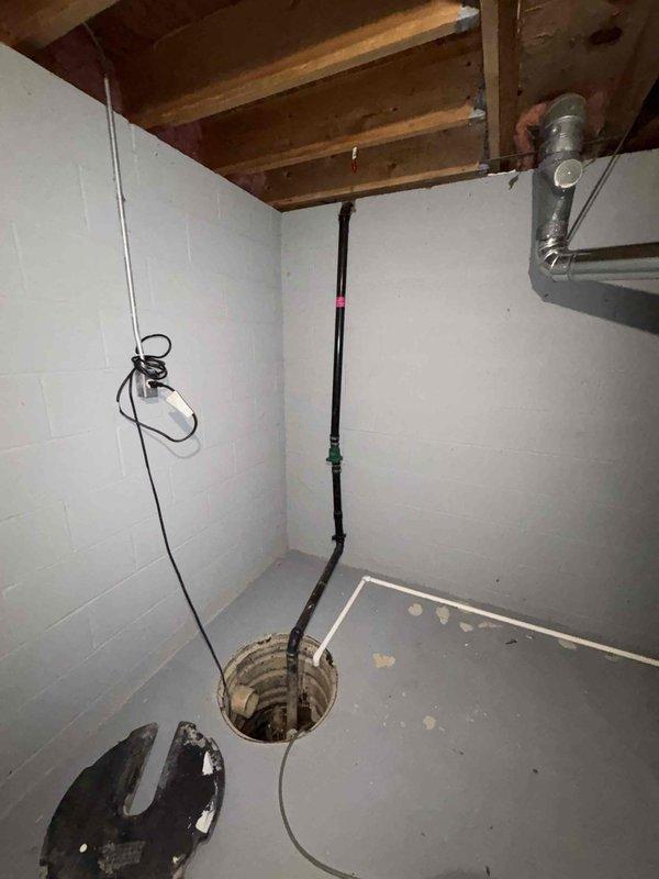 Responded to service call for sump pump failure that caused basement flooding. Upon inspection, found significant sediment and debris accumulation in sump pit, including rocks and pebbles that likely contributed to pump malfunction. Pump had automatically reactivated but required cleaning and testing to ensure proper operation.